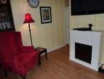 Enjoy a little time in front of the fireplace
                  while watching your large screen TV, or enjoying a
                  favorite book from the in suite library.