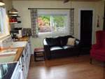 A
                  charming 50's style kitchen with authentic oversize
                  ceramic sink and butcher block counter tops.